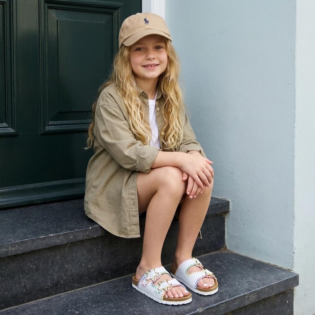 image:imageCUSHIONAIRE Lily Girl Toddler Sandals with Adjustable Gold Tone Star Buckles and Cushioned Cork Footbed Slip On Girls Slides for KidsWhite Woven